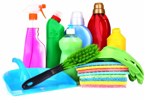 Carpet cleaning technician preparing equipment for a UK service appointment