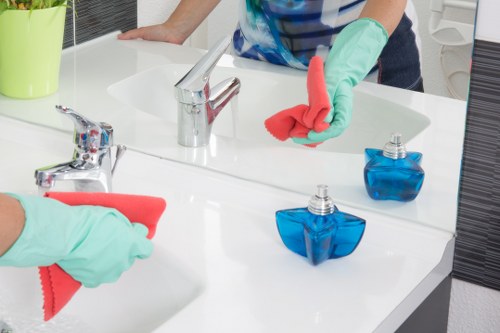 Cleaning technician handling equipment and chemicals safely